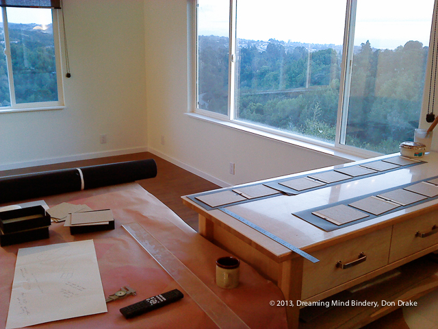 A copy of Wanderlost being bound in the newly constructed Dreaming Mind Studio prior to official move-in.