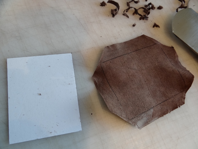 part ready to create a leather covered card pocket for the portfolio