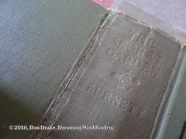 Detail of a repaired joint in a cloth book cover