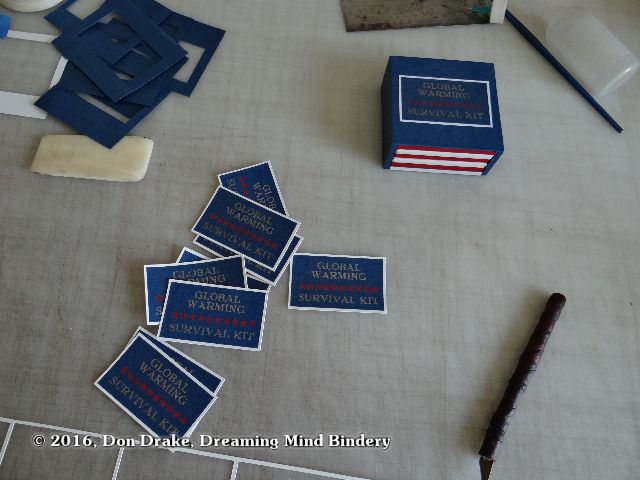 Labels ready to apply to copies of Don Drake's miniature book 'Global Warming Survival Kit'