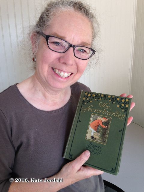 Kate Jordahl holding a first edition Secret Garden.