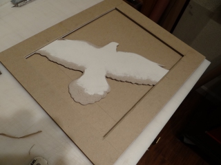 Assembling and doing the final sculpting of the bas-relief cover in preparation for covering in leather