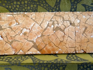 Detail of an eggshell panel covered kaleidoscope.