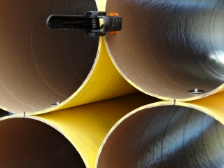 A detail of a partially assembled roll material storage unit.
