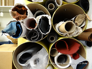 The ends of various rolls of bookbinding materials.