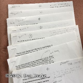 Many drafts of Don Drake's short story "The Day I Met George" stacked to show a few details at the top of each first page